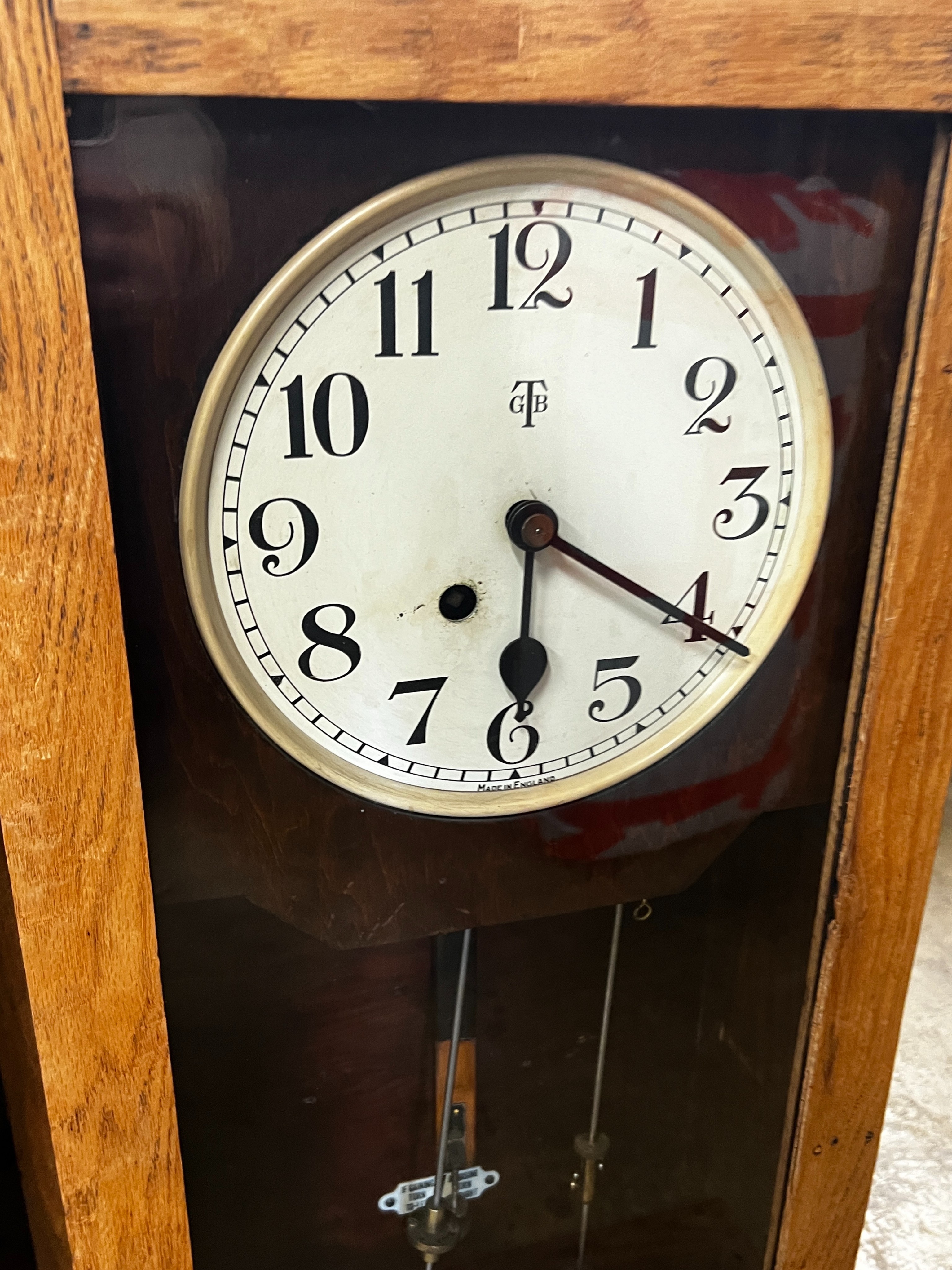 A vintage Gledhill-Brook oak cased clocking in machine, height 106cm